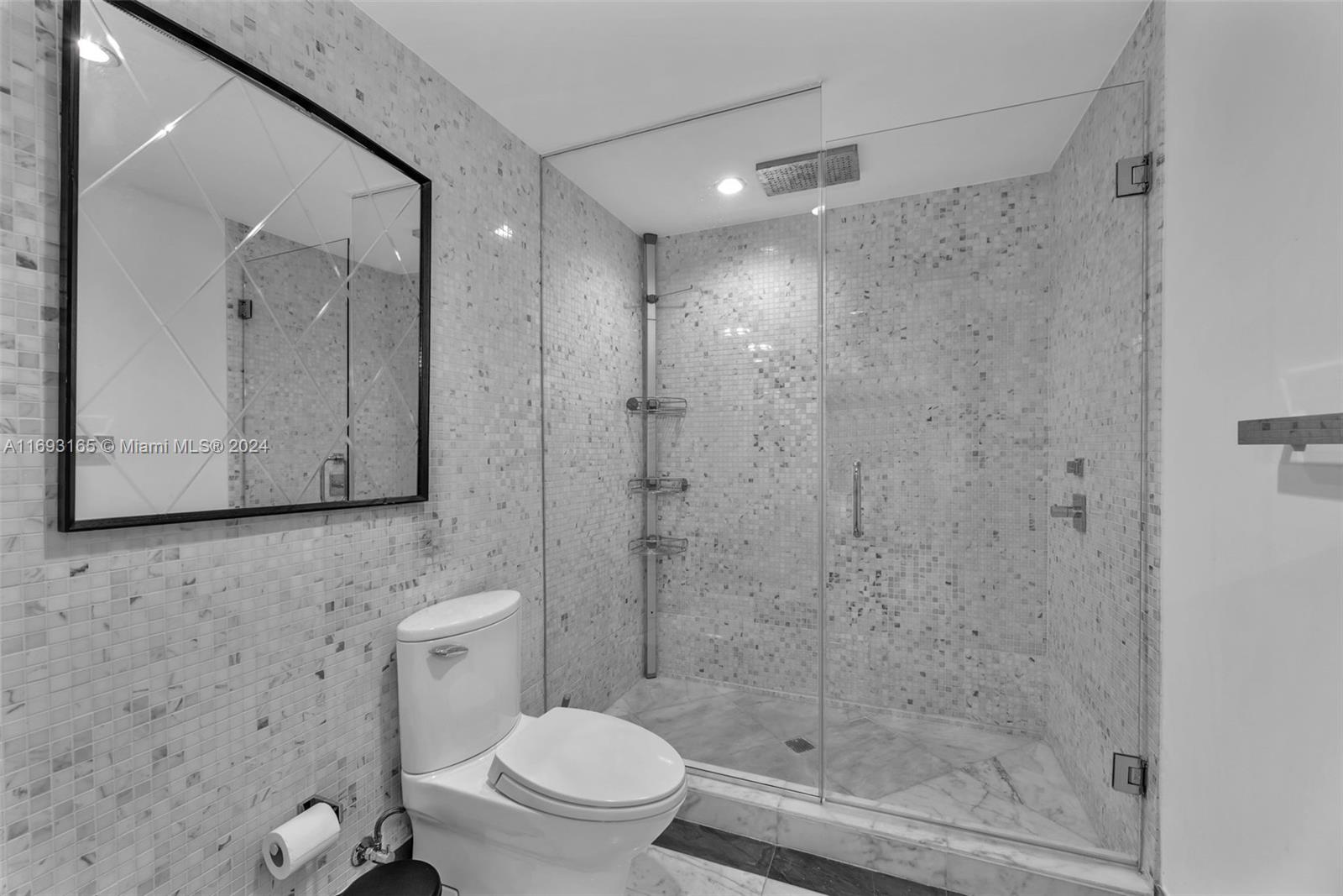 Downtown Miami Miami, FL 33131 - Photo 14 of 25 a bathroom with a shower a toilet and a sink