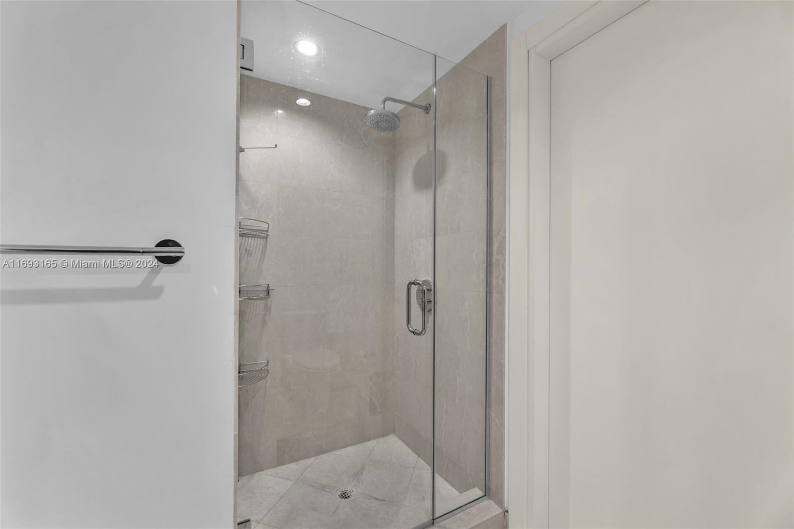 Downtown Miami Miami, FL 33131 - Photo 20 of 25 a bathroom with a shower and a sink