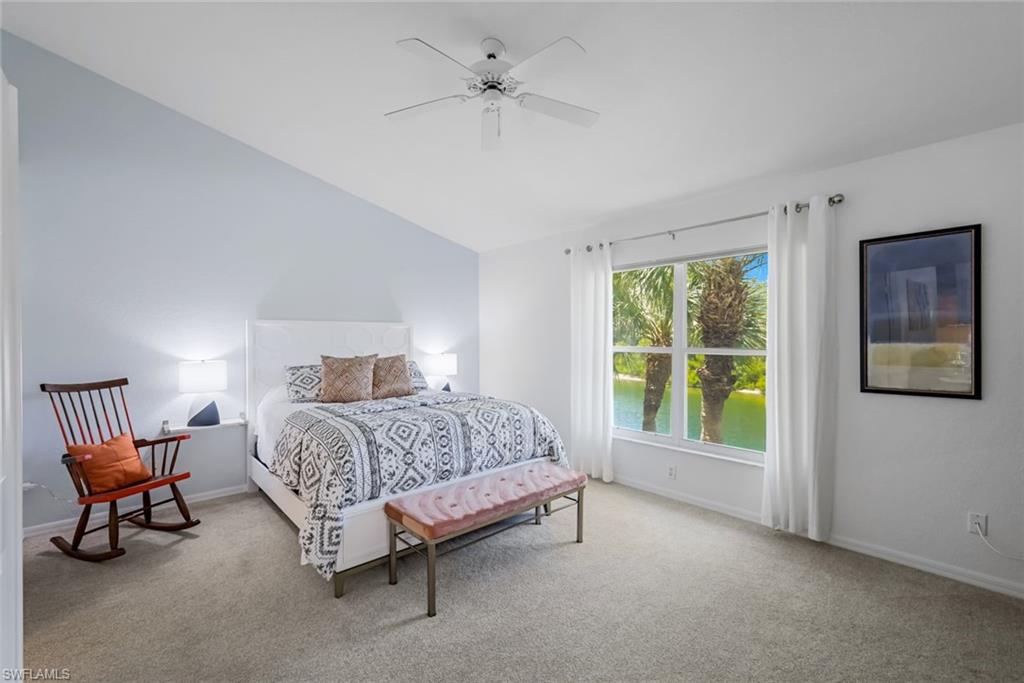 5360 Andover Drive, Unit 202 Naples, FL 34110 - Photo 14 of 25 a spacious bedroom with a bed and a window