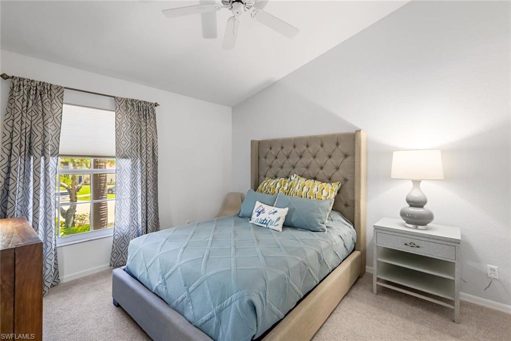 5360 Andover Drive, Unit 202 Naples, FL 34110 - Photo 17 of 25 a bedroom with a bed and window