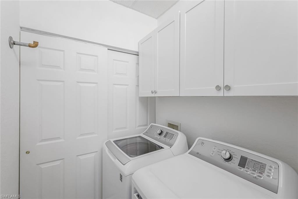 5360 Andover Drive, Unit 202 Naples, FL 34110 - Photo 23 of 25 a utility room with dryer and washer