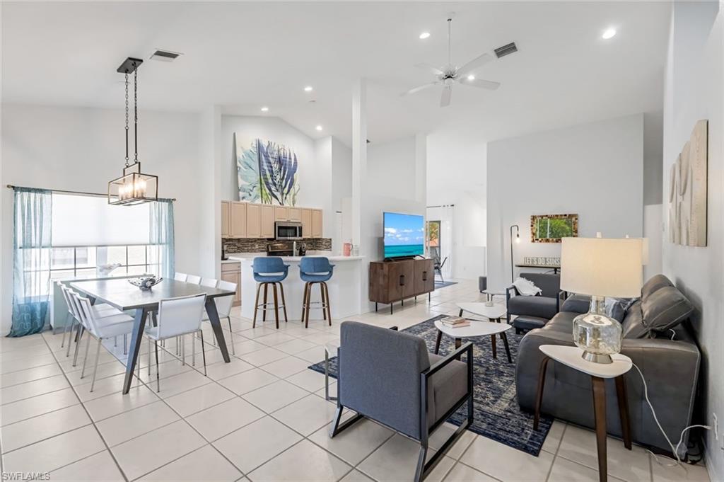 5360 Andover Drive, Unit 202 Naples, FL 34110 - Photo 7 of 25 a living room with furniture and a wooden floor