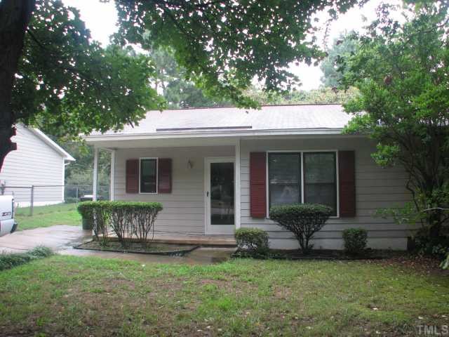 3706 Pine Knoll Drive Raleigh, NC 27604 - Photo 1 of 3 a front view of a house with a garden