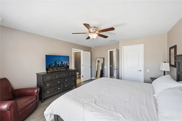 a bedroom with a bed and a couch