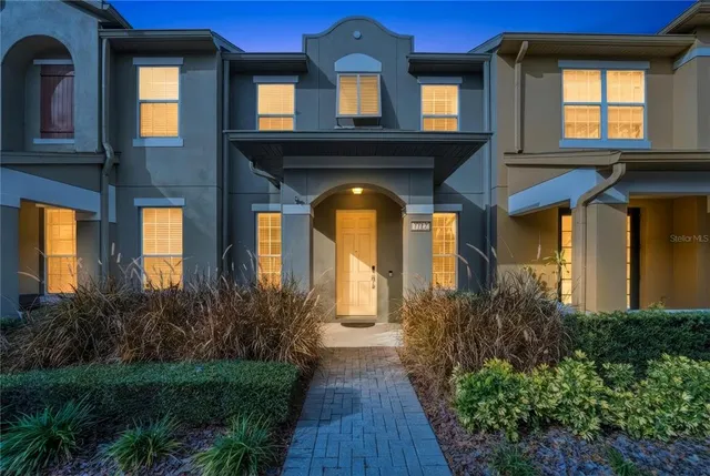 a front view of house and yard with green space
