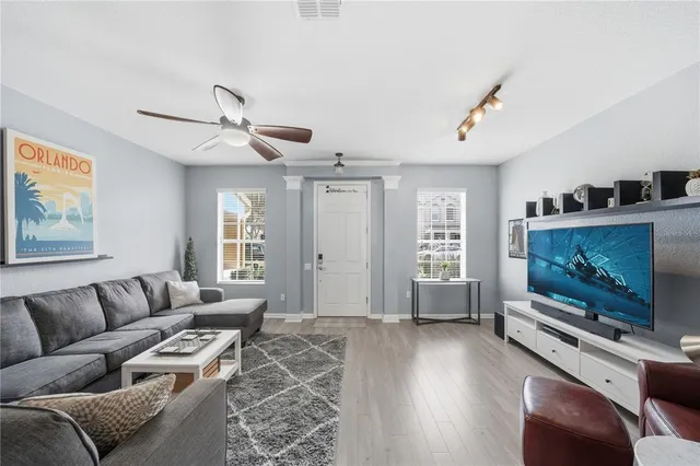 a living room with furniture and a flat screen tv