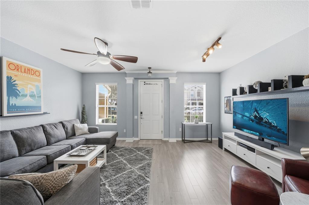 7712 Moser Avenue Windermere, FL 34786 - Photo 5 of 30 a living room with furniture and a flat screen tv