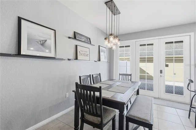 a view of a dining room with furniture large window and wooden floor