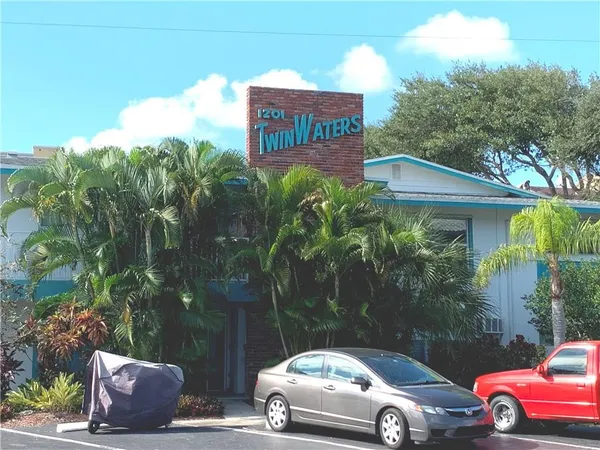 a front view of a house with parking