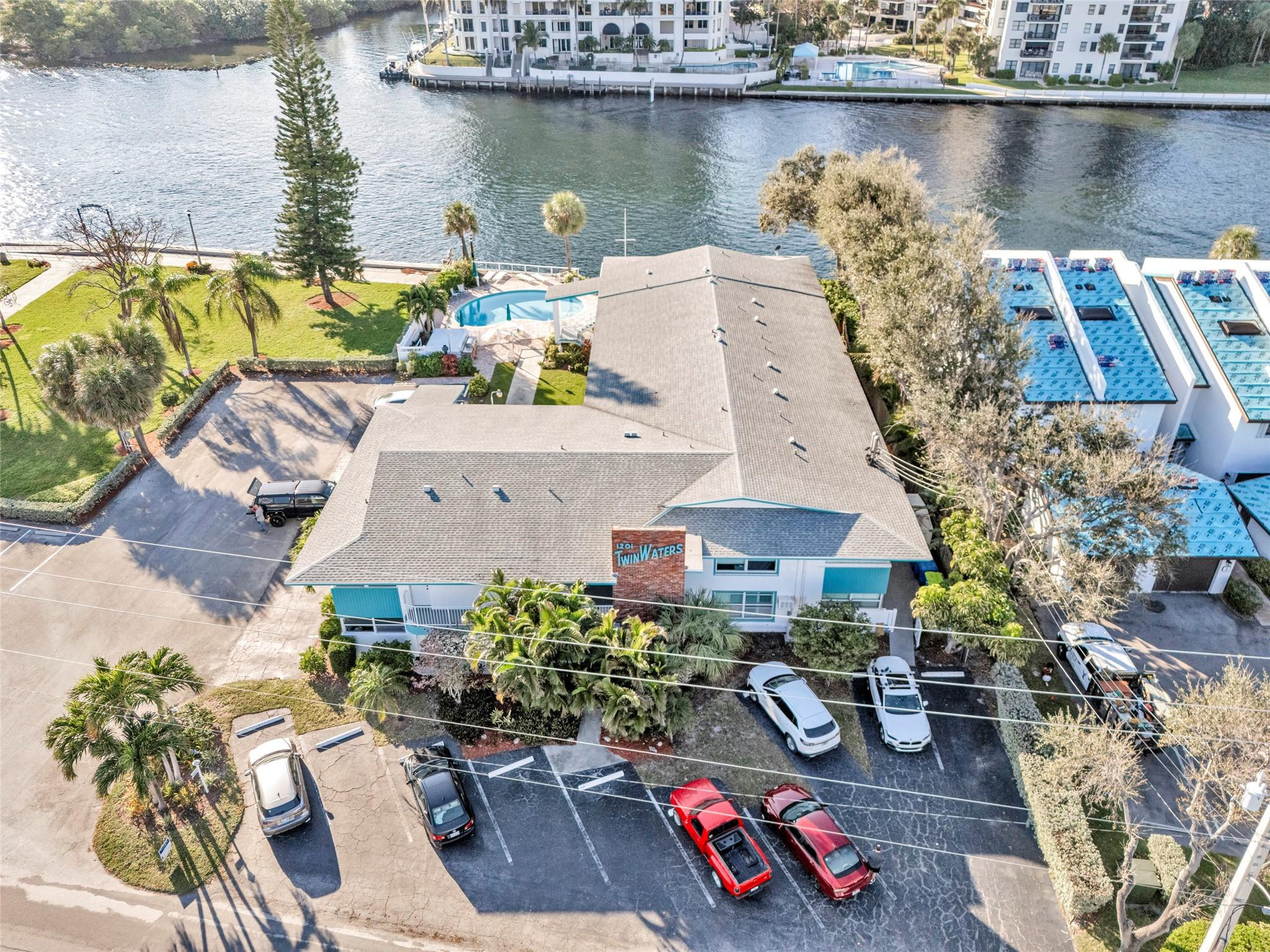 1201 North Riverside Drive, Unit 12B Pompano Beach, FL 33062 - Photo 2 of 63 an aerial view of a house with swimming pool and outdoor seating