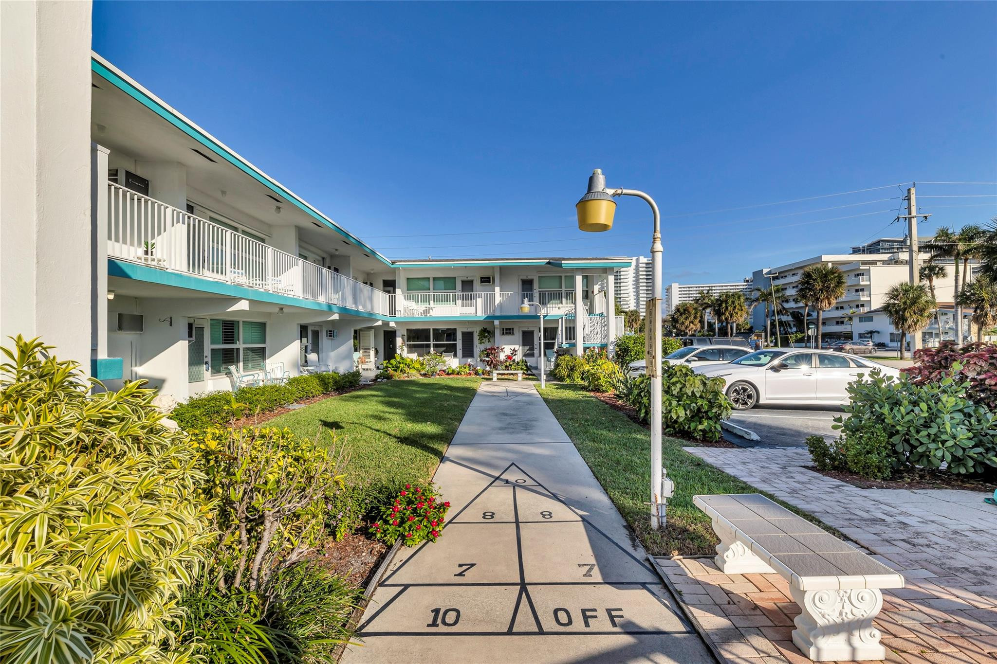 1201 North Riverside Drive, Unit 12B Pompano Beach, FL 33062 - Photo 29 of 63 a view of a building with many windows and plants