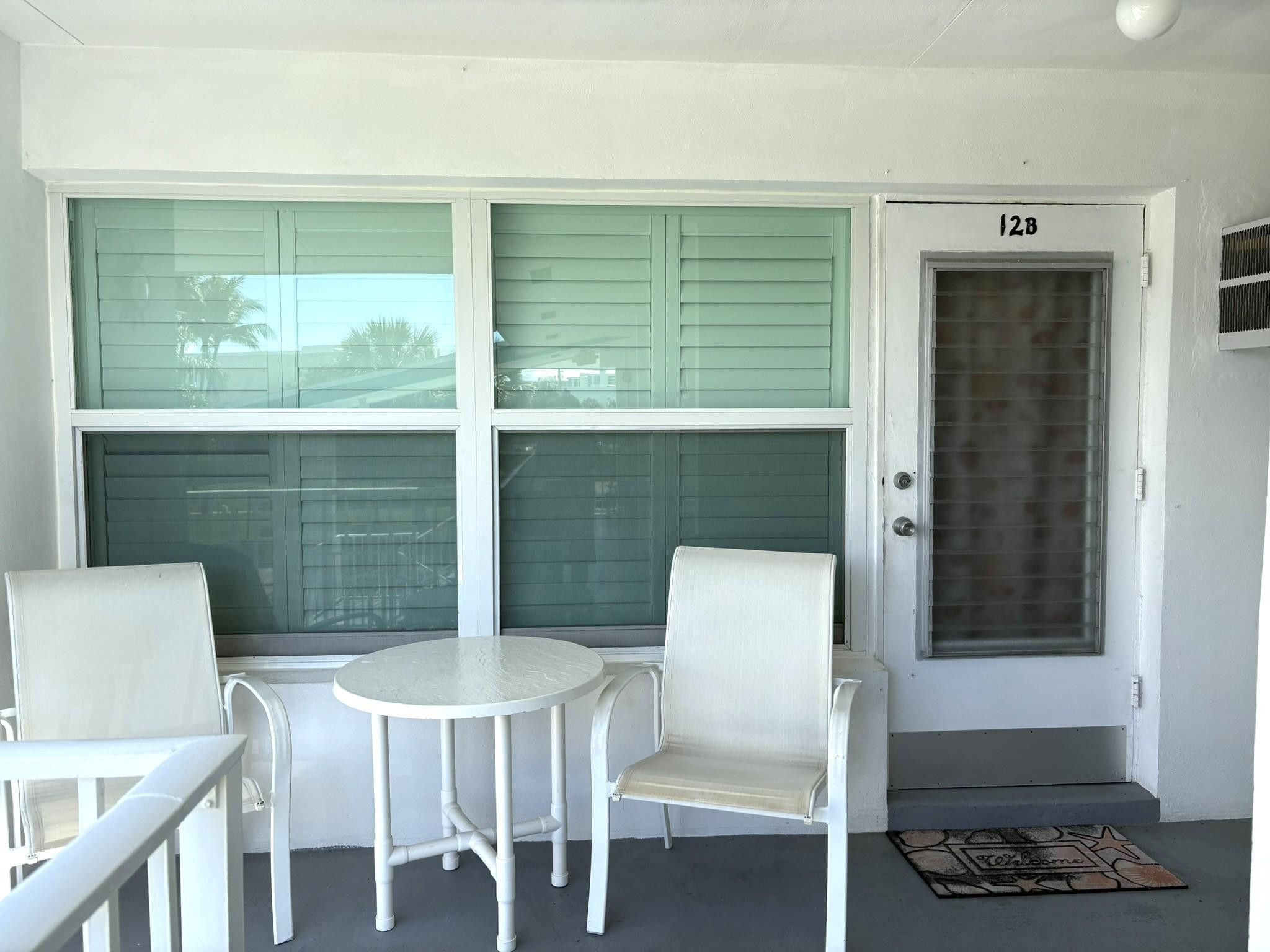 1201 North Riverside Drive, Unit 12B Pompano Beach, FL 33062 - Photo 35 of 63 a kitchen with a table chairs and a window