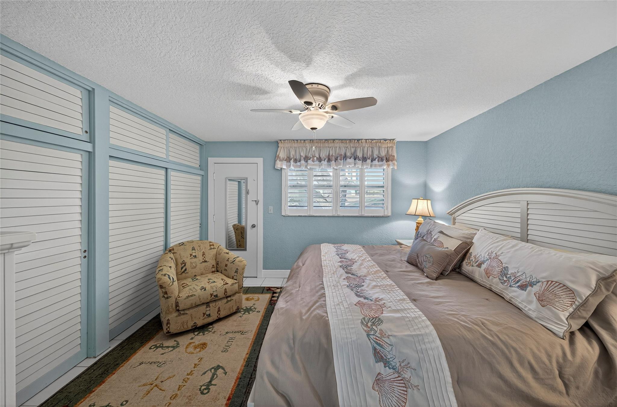 1201 North Riverside Drive, Unit 12B Pompano Beach, FL 33062 - Photo 40 of 63 a bedroom with a bed and a window