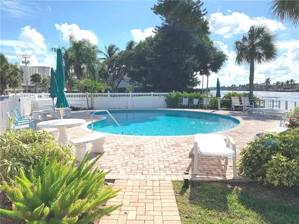 a view of a swimming pool with a patio