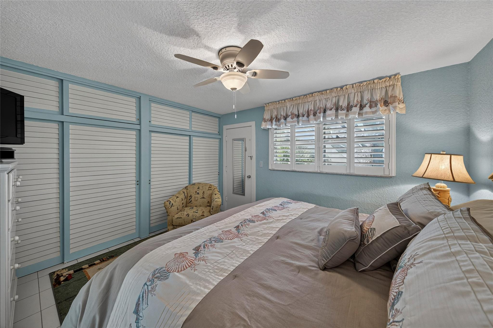 1201 North Riverside Drive, Unit 12B Pompano Beach, FL 33062 - Photo 41 of 63 a bedroom with a bed and a window