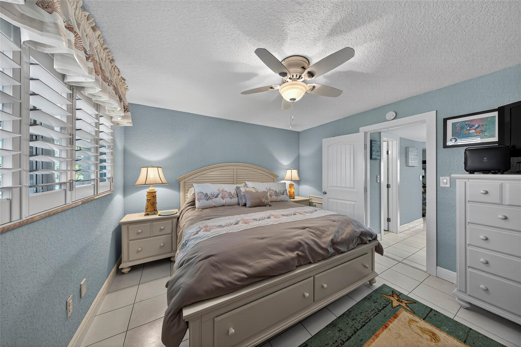 1201 North Riverside Drive, Unit 12B Pompano Beach, FL 33062 - Photo 42 of 63 a bedroom with a bed and a dresser