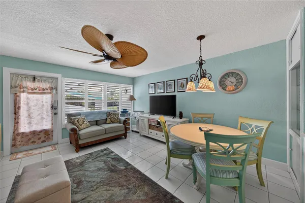 a dining room with furniture and window