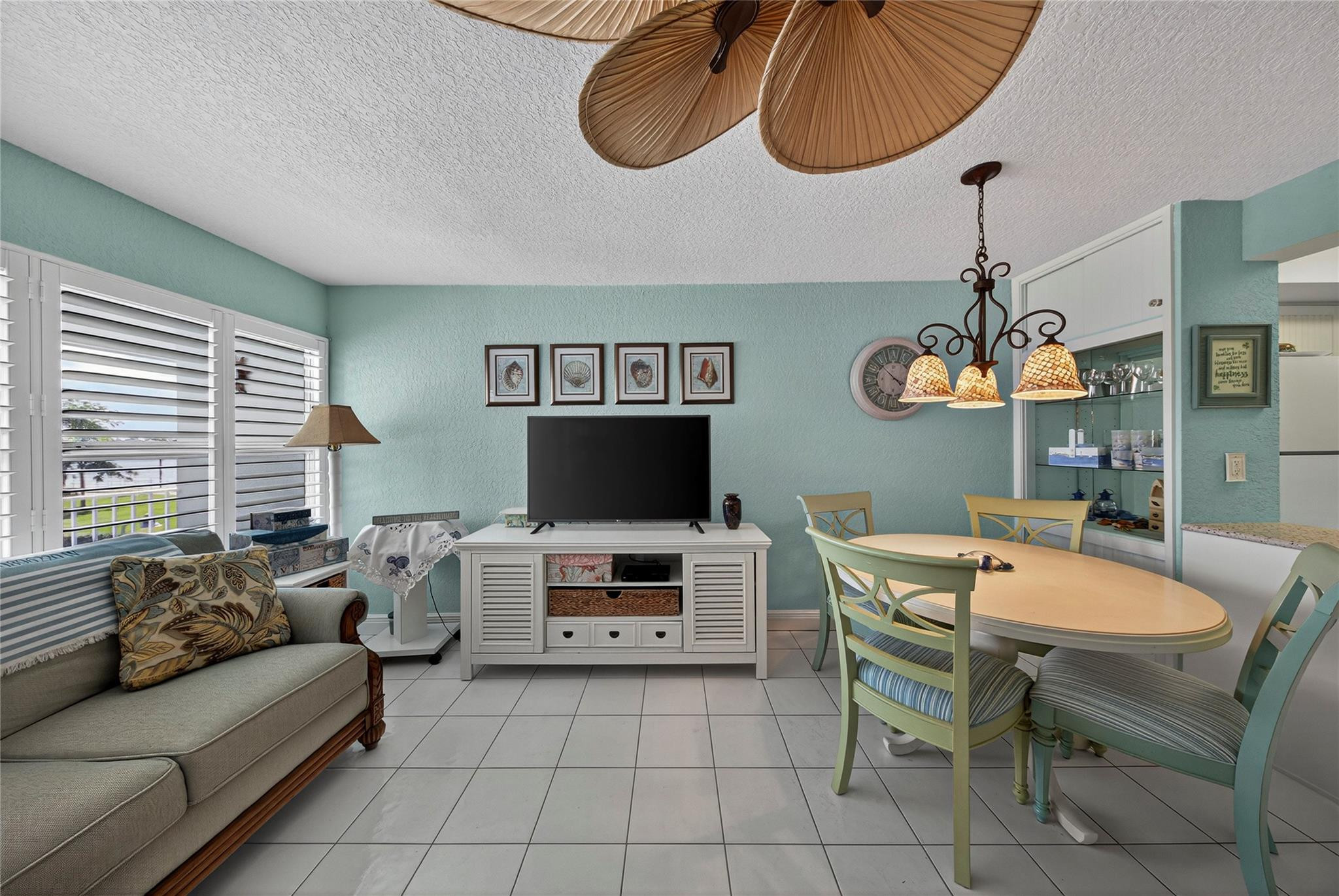 1201 North Riverside Drive, Unit 12B Pompano Beach, FL 33062 - Photo 51 of 63 a living room with furniture kitchen view and a window