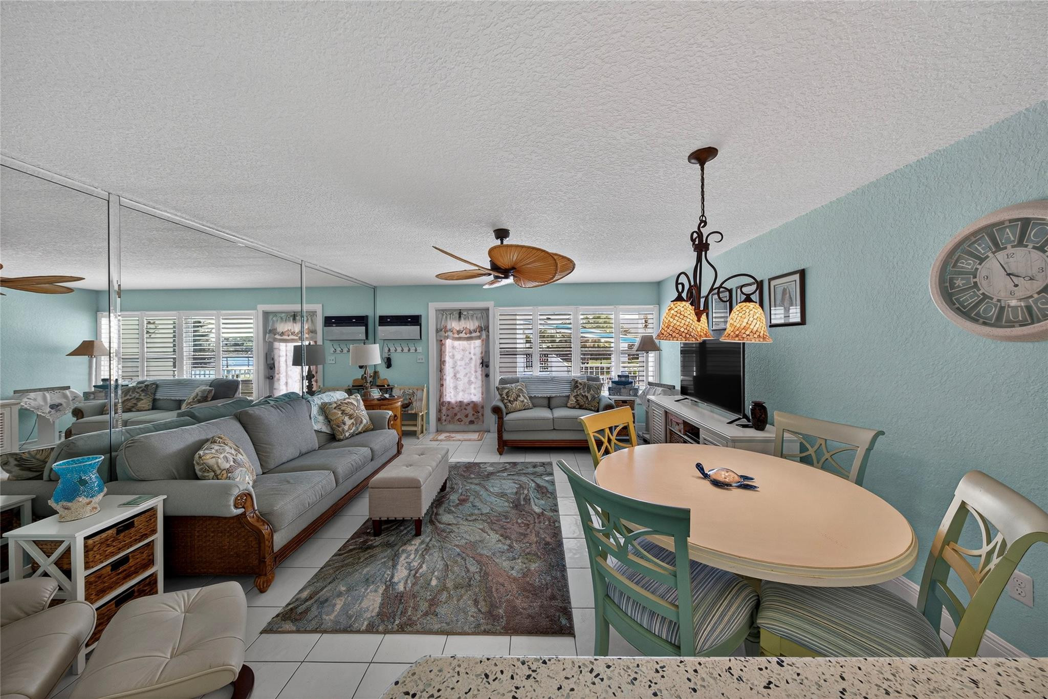 1201 North Riverside Drive, Unit 12B Pompano Beach, FL 33062 - Photo 59 of 63 a living room with furniture a rug and a table