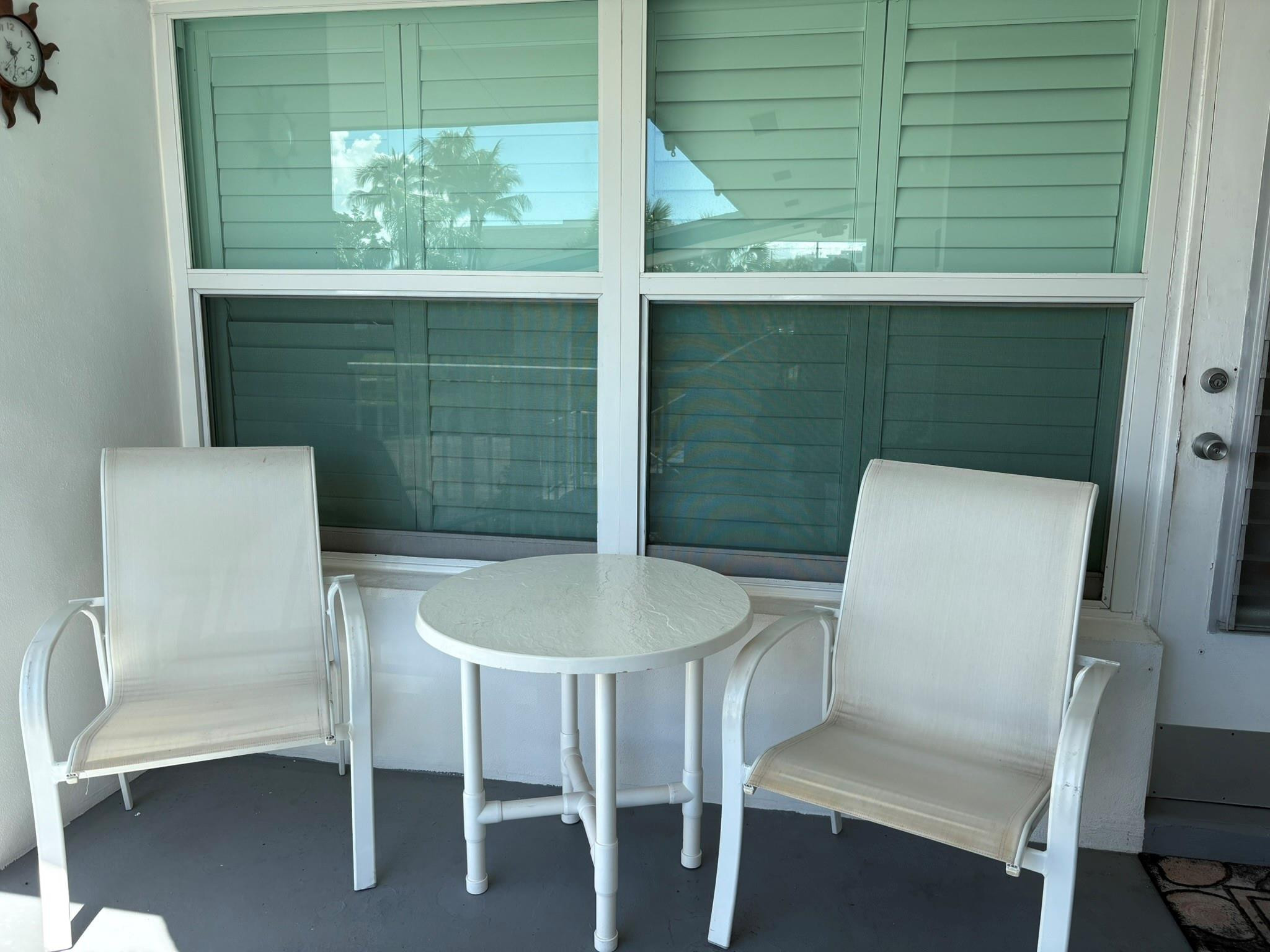 1201 North Riverside Drive, Unit 12B Pompano Beach, FL 33062 - Photo 7 of 63 a dining room with furniture and window