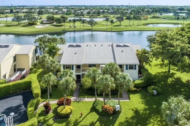 an aerial view of a house with a lake view