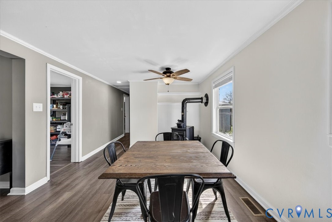 8427 Pamunkey Road Spotsylvania, VA 22551 - Photo 15 of 50 a view of a dining room with furniture and wooden floor
