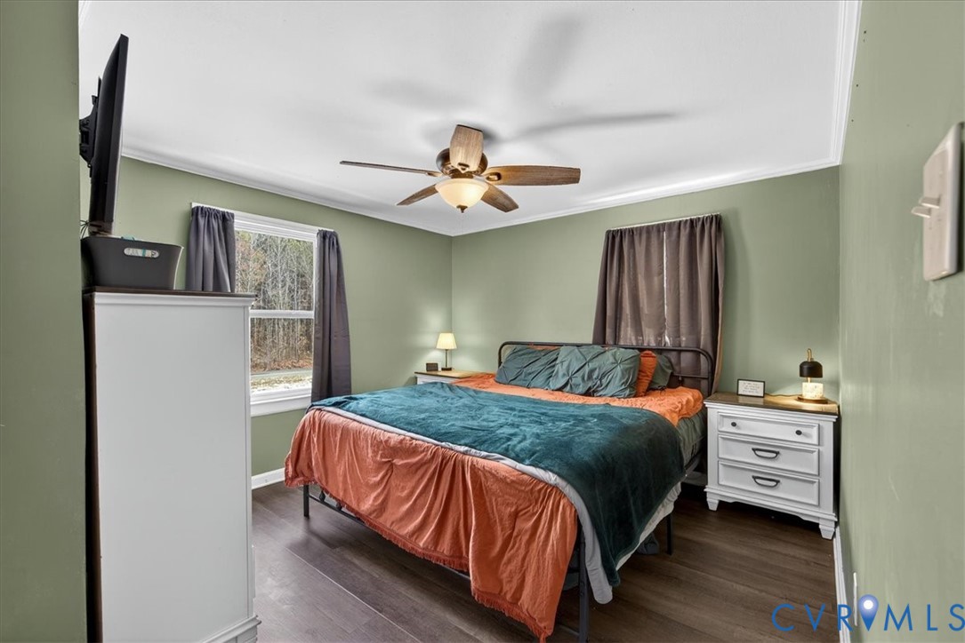 8427 Pamunkey Road Spotsylvania, VA 22551 - Photo 17 of 50 a bedroom with a bed and a chandelier