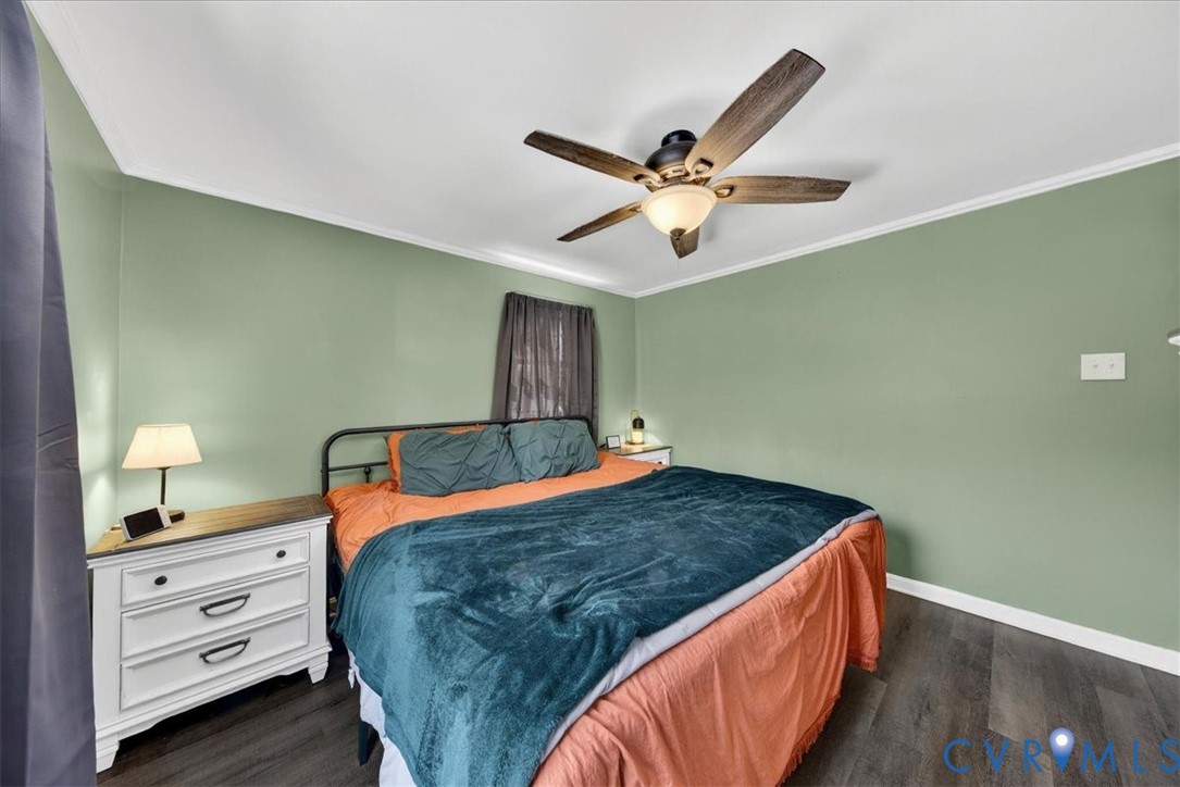 8427 Pamunkey Road Spotsylvania, VA 22551 - Photo 18 of 50 a bedroom with a bed and a chandelier