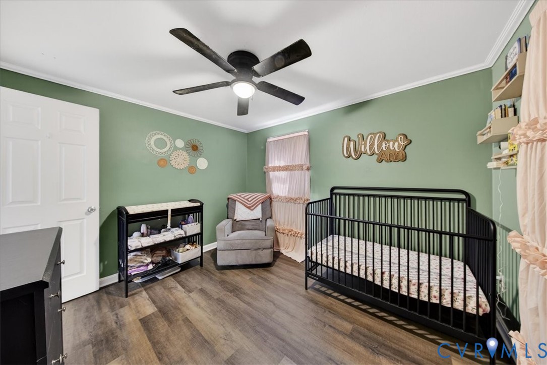 8427 Pamunkey Road Spotsylvania, VA 22551 - Photo 21 of 50 a view of a livingroom with furniture and a ceiling fan