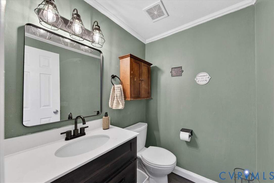 8427 Pamunkey Road Spotsylvania, VA 22551 - Photo 23 of 50 a bathroom with a sink vanity mirror and toilet