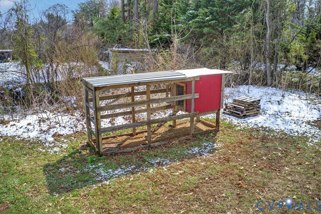 8427 Pamunkey Road Spotsylvania, VA 22551 - Photo 37 of 50 a view of a chairs and table in the backyard