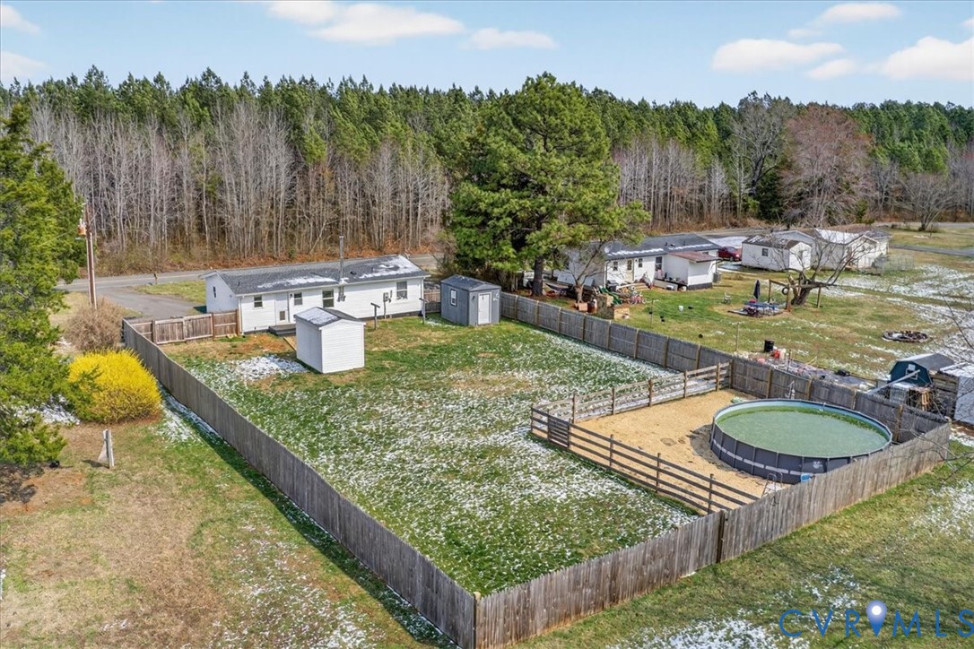 8427 Pamunkey Road Spotsylvania, VA 22551 - Photo 49 of 50 a view of swimming pool with a patio and a garden