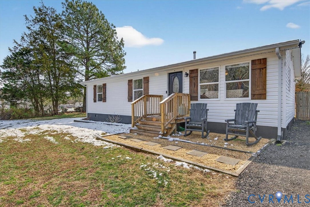 8427 Pamunkey Road Spotsylvania, VA 22551 - Photo 50 of 50 a house view with a sitting space and wooden fence