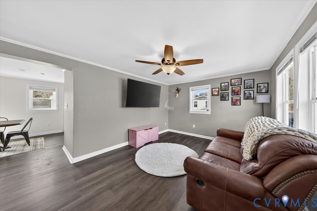 8427 Pamunkey Road Spotsylvania, VA 22551 - Photo 5 of 50 a living room with furniture and a flat screen tv