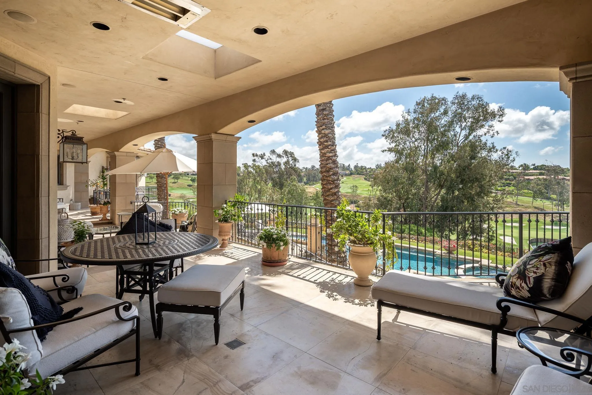 7756 St Andrews Road Rancho Santa Fe, CA 92067 - Photo 9 of 46 a balcony with furniture and a large window
