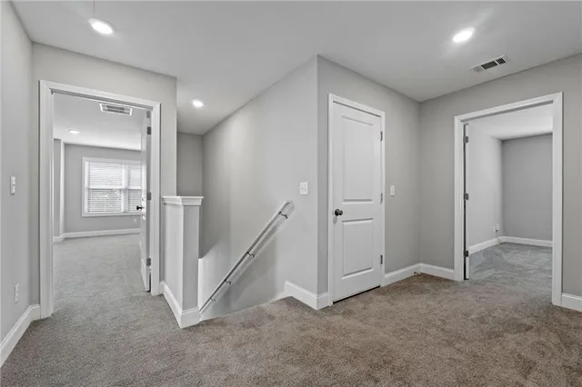 an empty room with a bathroom and sink