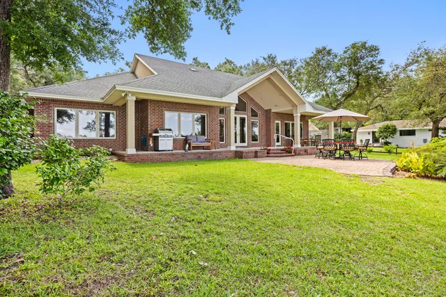 a view of a chairs and table in the garden