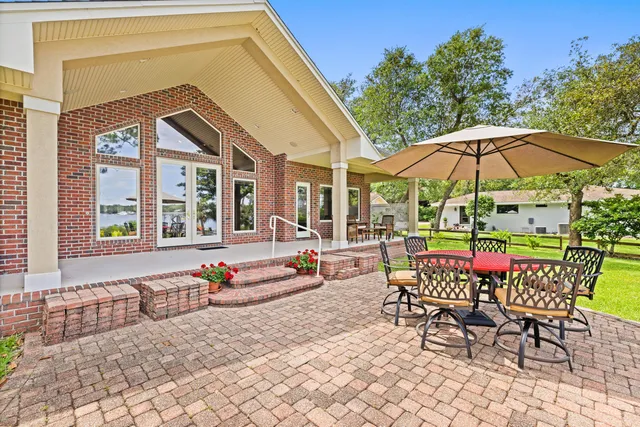 a front view of a building with potted plants