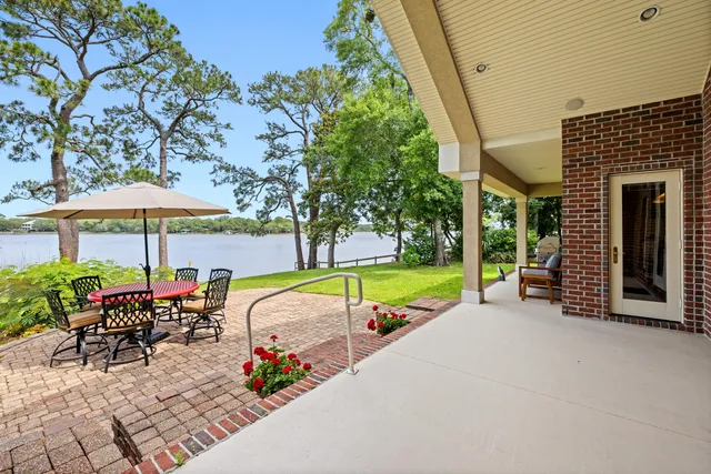 a view of backyard of house with green space