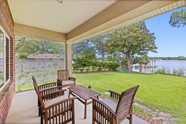 a living room with fireplace furniture and a flat screen tv