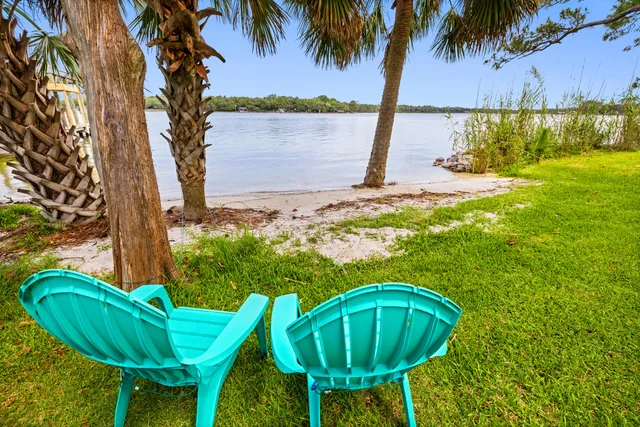 a view of a dining room with furniture wooden floor and chandelier