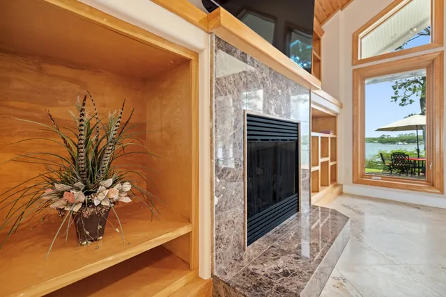 a bathroom with a double vanity sink mirror and shower