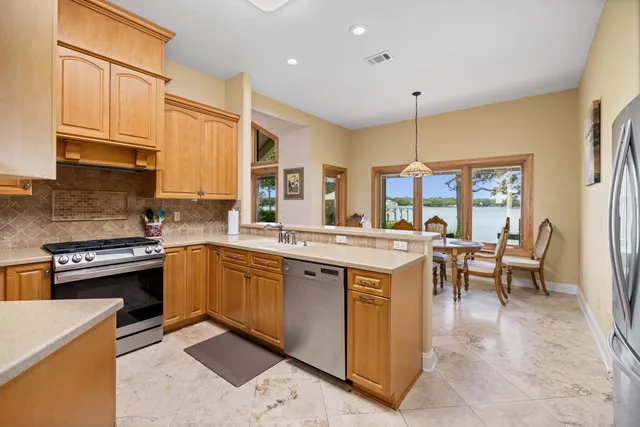 a bed room with a bed and a flat tv screen