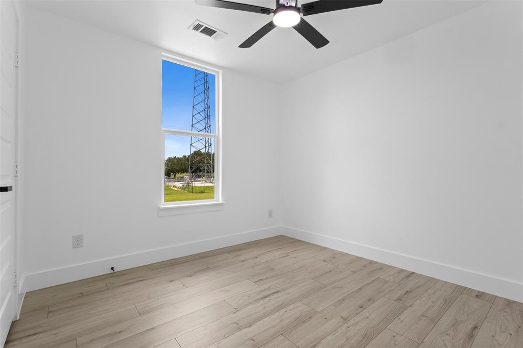 180 County Road 2245 Emory, TX 75440 - Photo 26 of 34 wooden floor in an empty room with a window