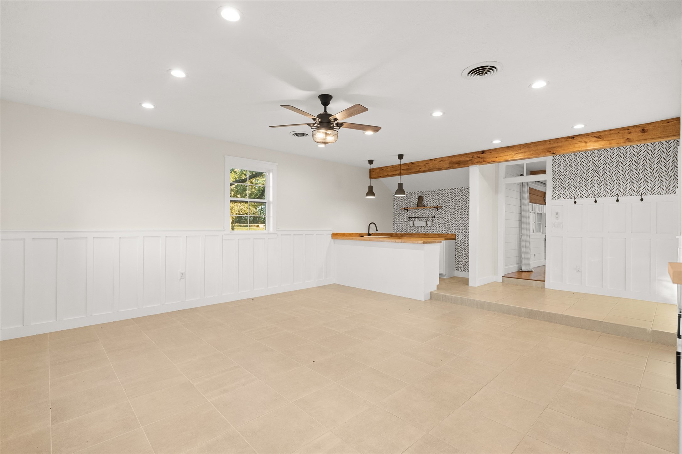 351 Pleasant Hill School Road Brenham, TX 77833 - Photo 20 of 46 wooden floor in an empty room with a ceiling fan