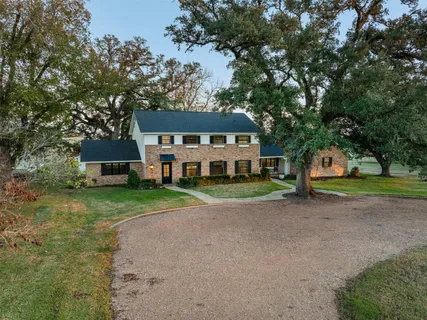 a view of house with outdoor space area