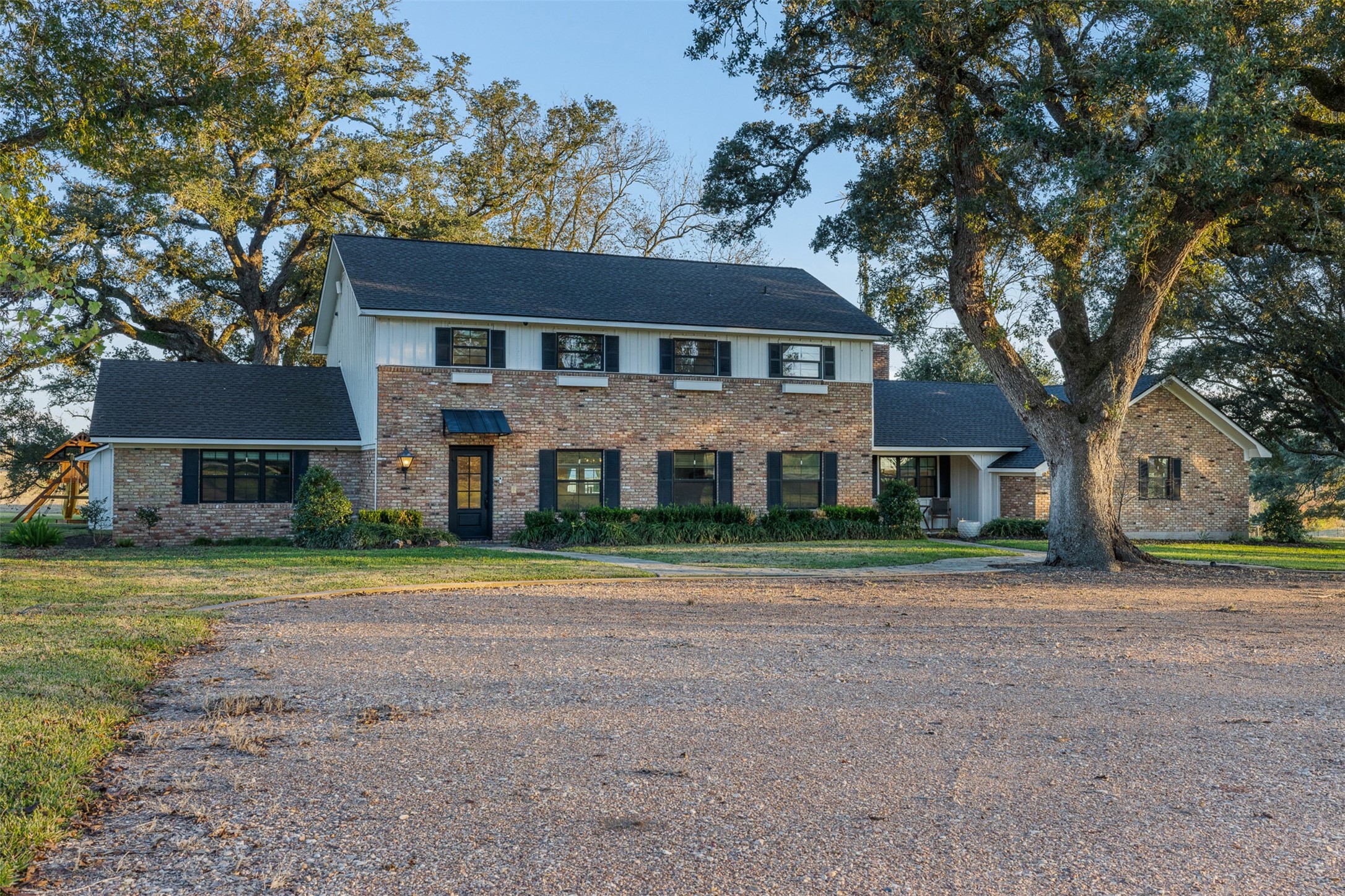 351 Pleasant Hill School Road Brenham, TX 77833 - Photo 34 of 46 a front view of a house with a yard