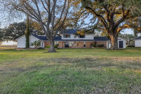 a house view with a sitting space and garden view