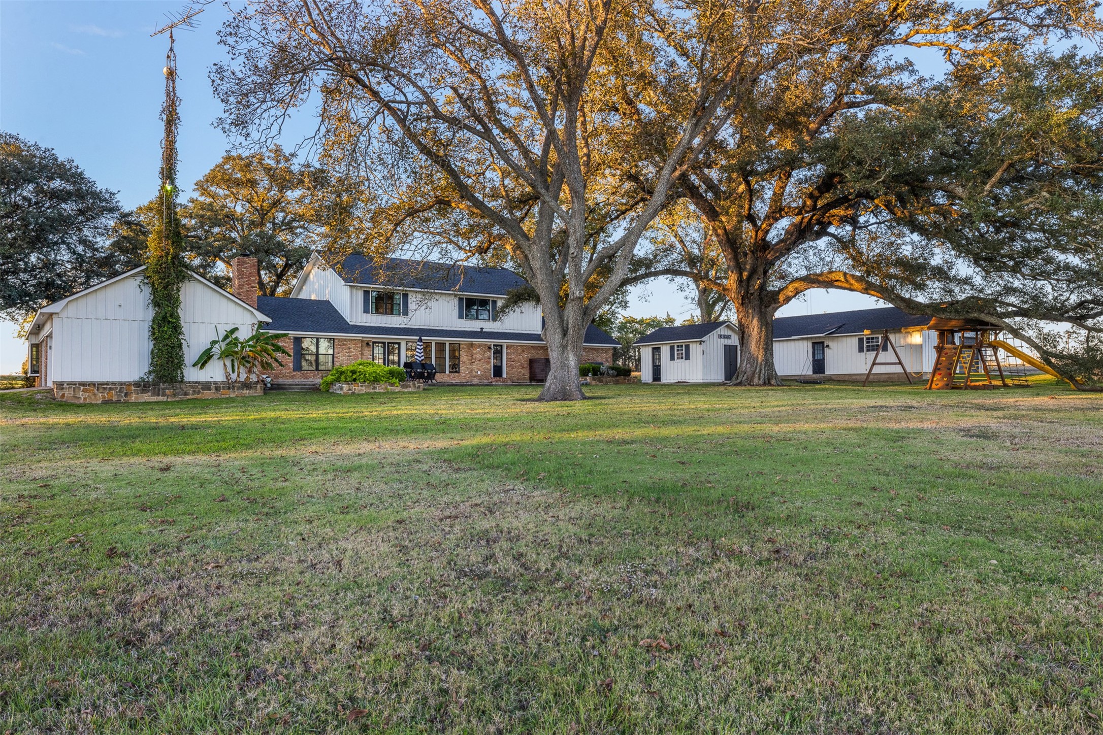 351 Pleasant Hill School Road Brenham, TX 77833 - Photo 38 of 46 a house view with a sitting space and garden view