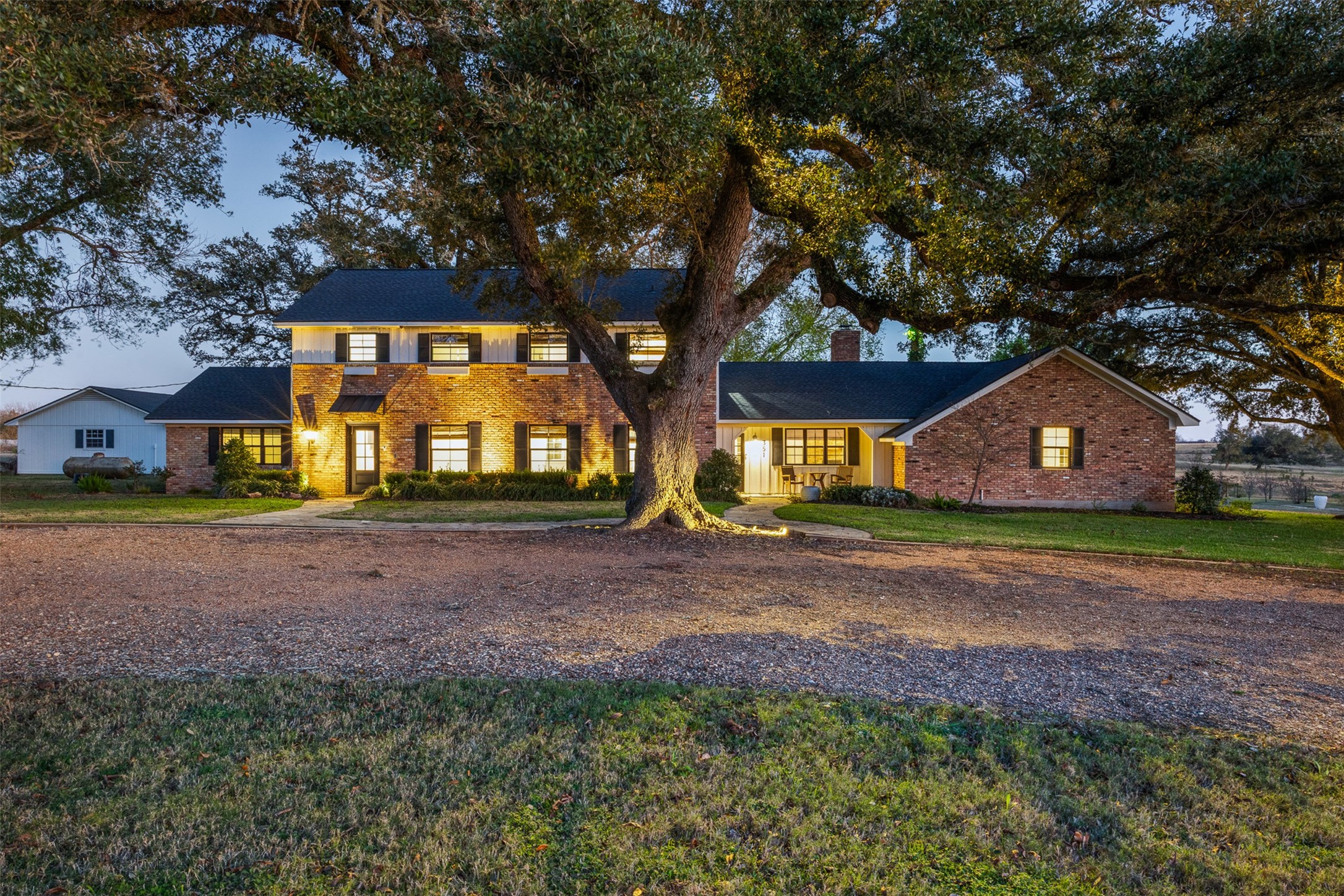 351 Pleasant Hill School Road Brenham, TX 77833 - Photo 42 of 46 a front view of a house with a yard